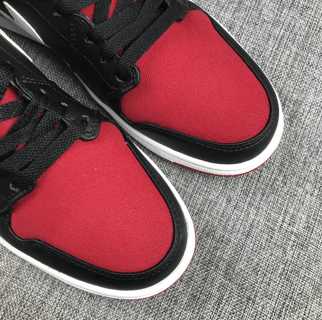 Black Red Canvas-Style Sneakers - Jordan 1 Mid 554724-020 - product image from the listing.