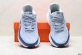 Nike Revolution 8 Running Shoes, in Light Blue and Navy - product image from the listing.