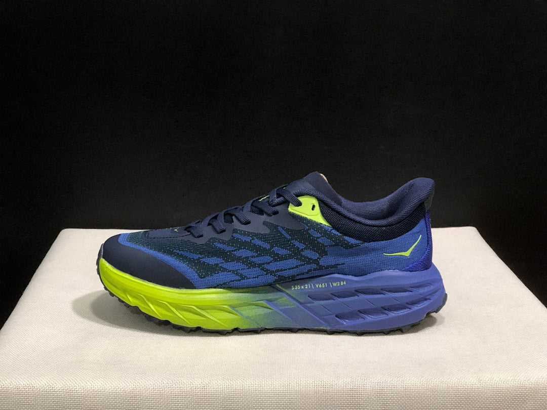 HOKA Speedgoat 5 Trail Running Shoes, in Navy and Lime - product image from the listing.