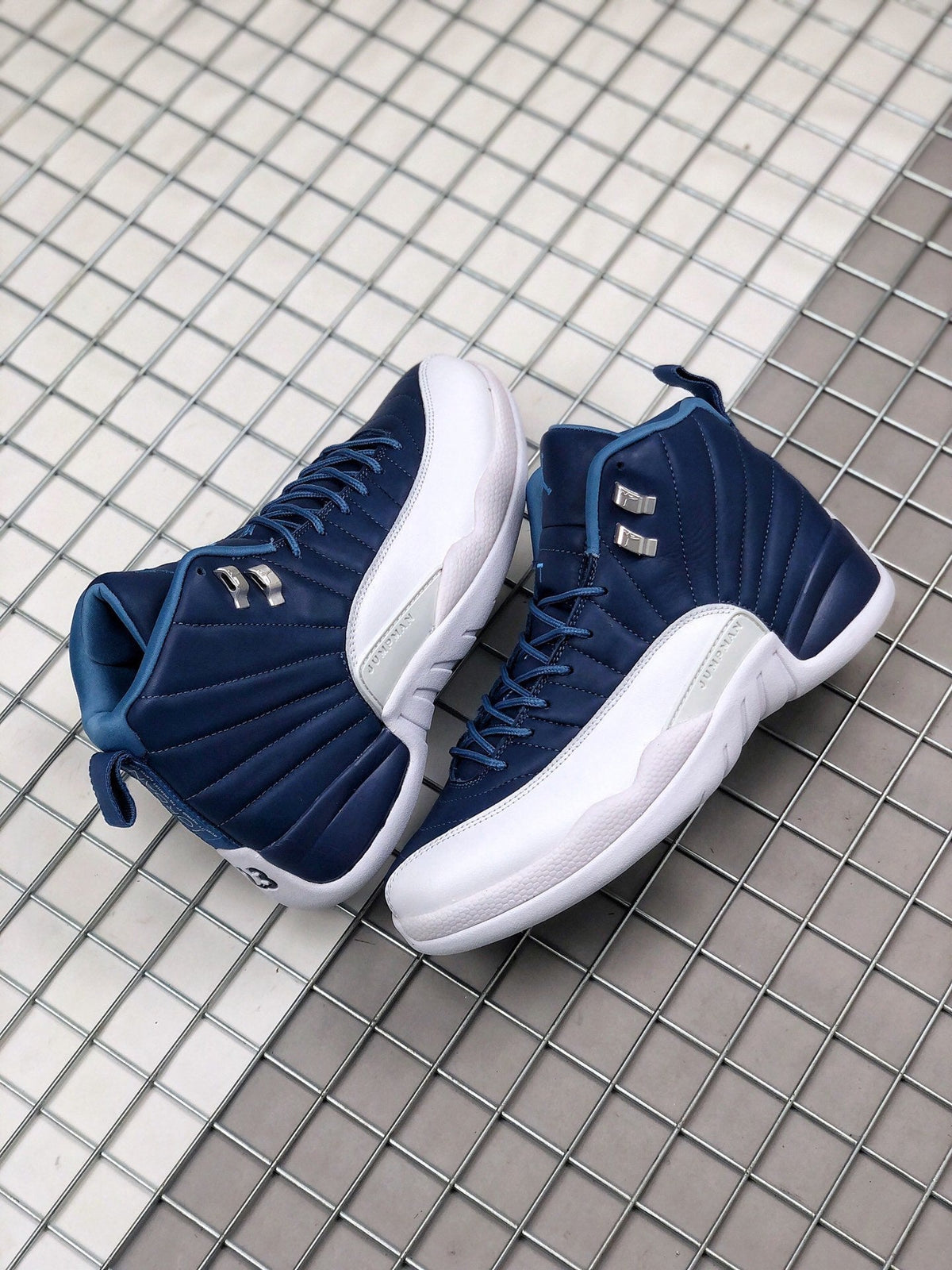 Air Jordan 12 Indigo Sneakers 130690-404 - product image from the listing.