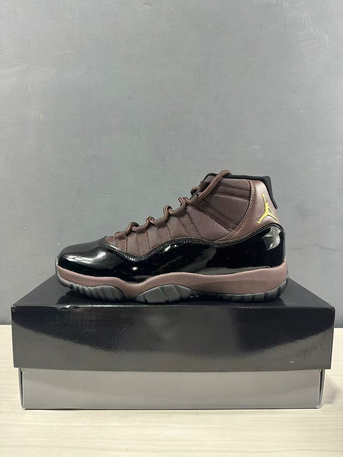 Air Jordan 11 Retro Black Bronze High-Top Sneakers - product image from the listing.