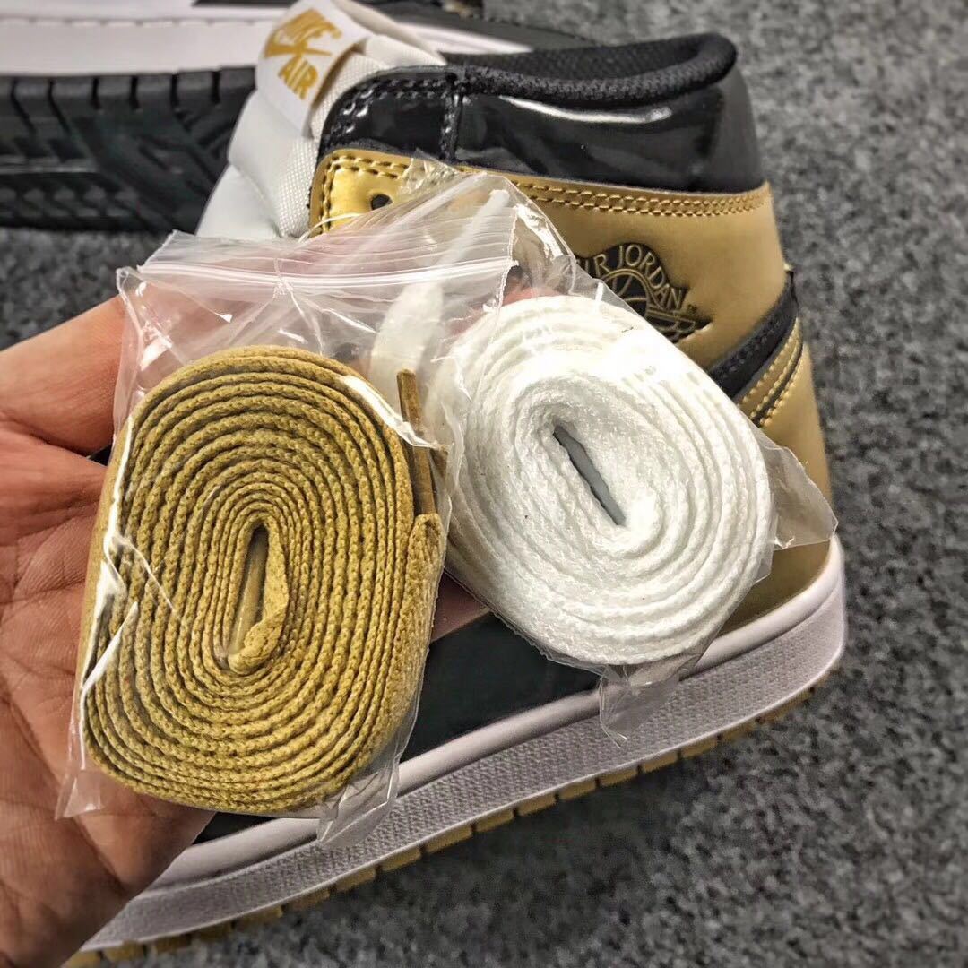 Jordan 1 High Mismatched Sneakers in Black Gold White - product image from the listing.