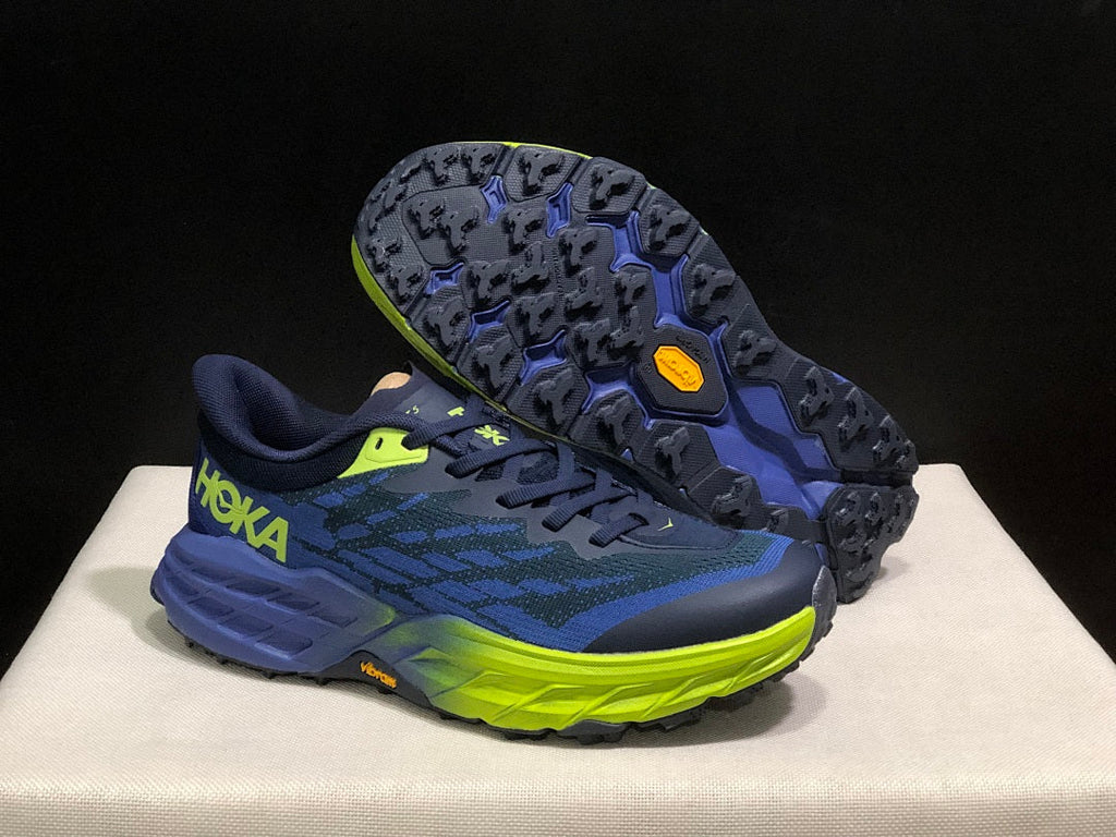 HOKA Speedgoat 5 Trail Running Shoes, in Navy and Lime - product image from the listing.