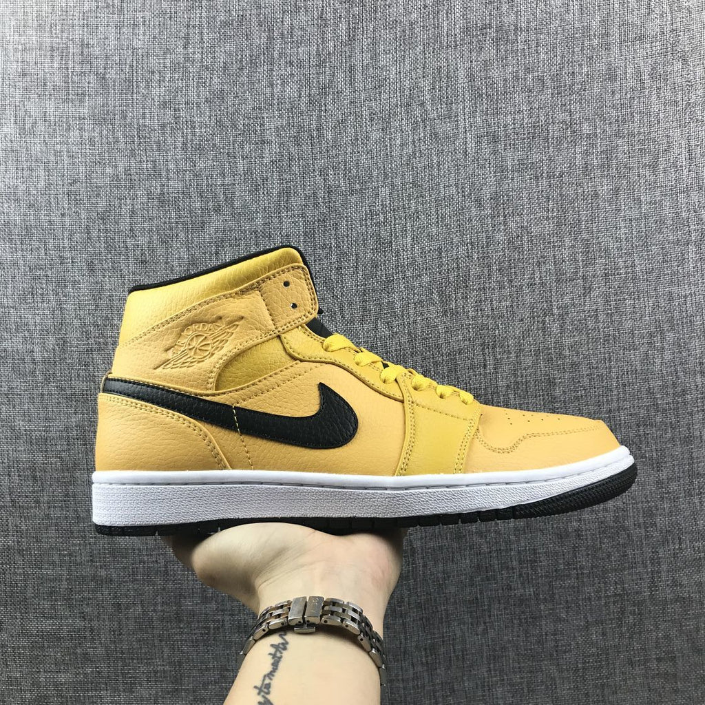 Air Jordan 1 Mid Yellow Ochre Sneakers in Black 554724-700 - product image from the listing.