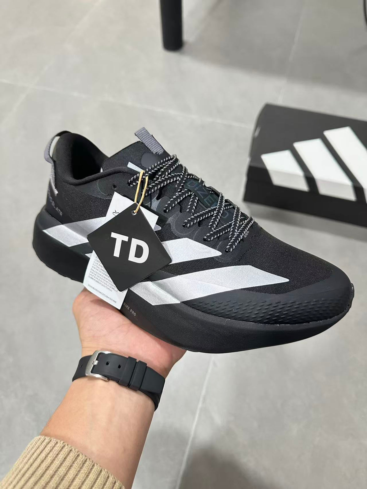 Adidas Lightstrike Pro Black Shoes for Running with White Stripes - product image from the listing.