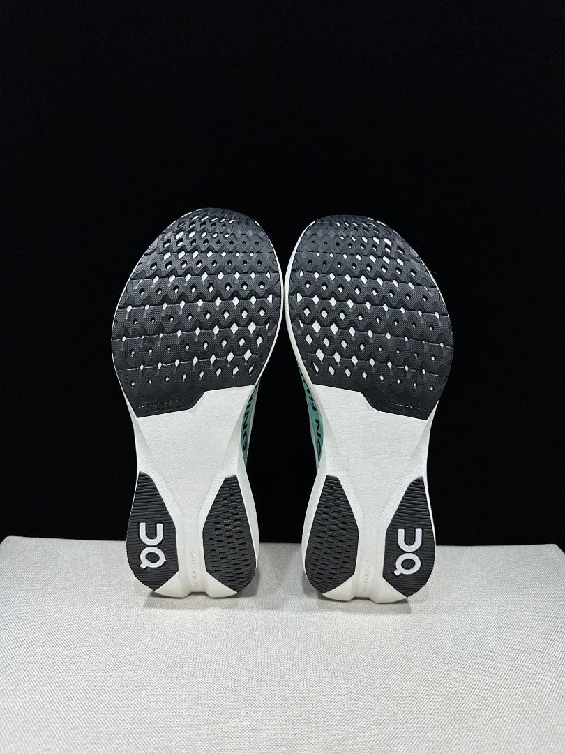 On Cloudboom Strike LS Running Shoes in White Light Green - product image from the listing.