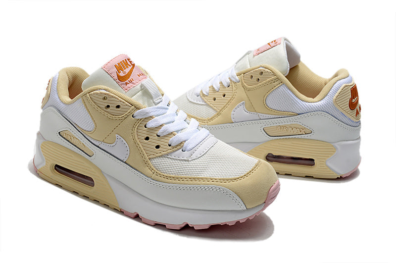 Women's Nike Air Max 90 Sneakers in Cream and Pink - product image from the listing.
