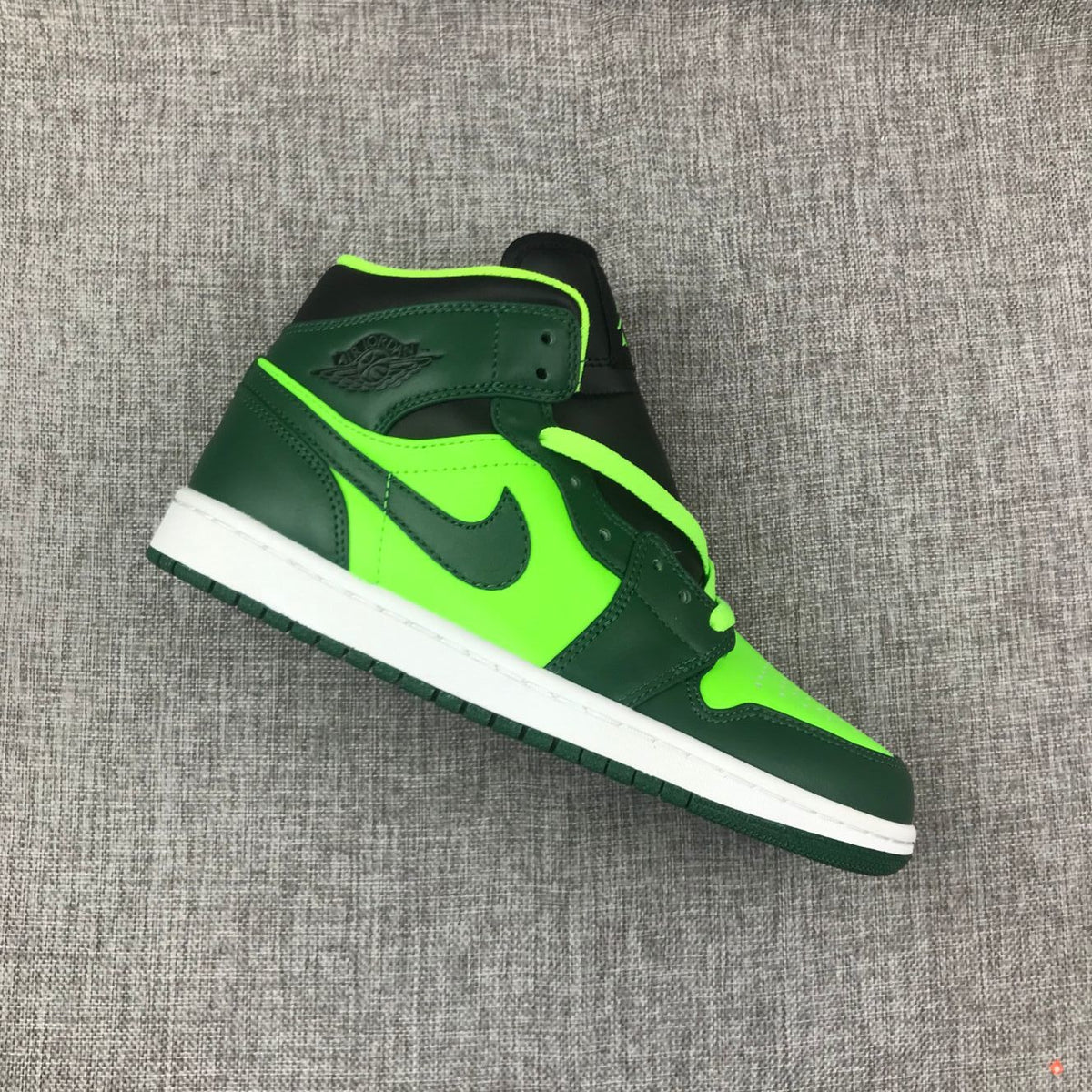 Air Jordan 1 Mid Fluorescent Sneakers in Green 554724-330 - product image from the listing.