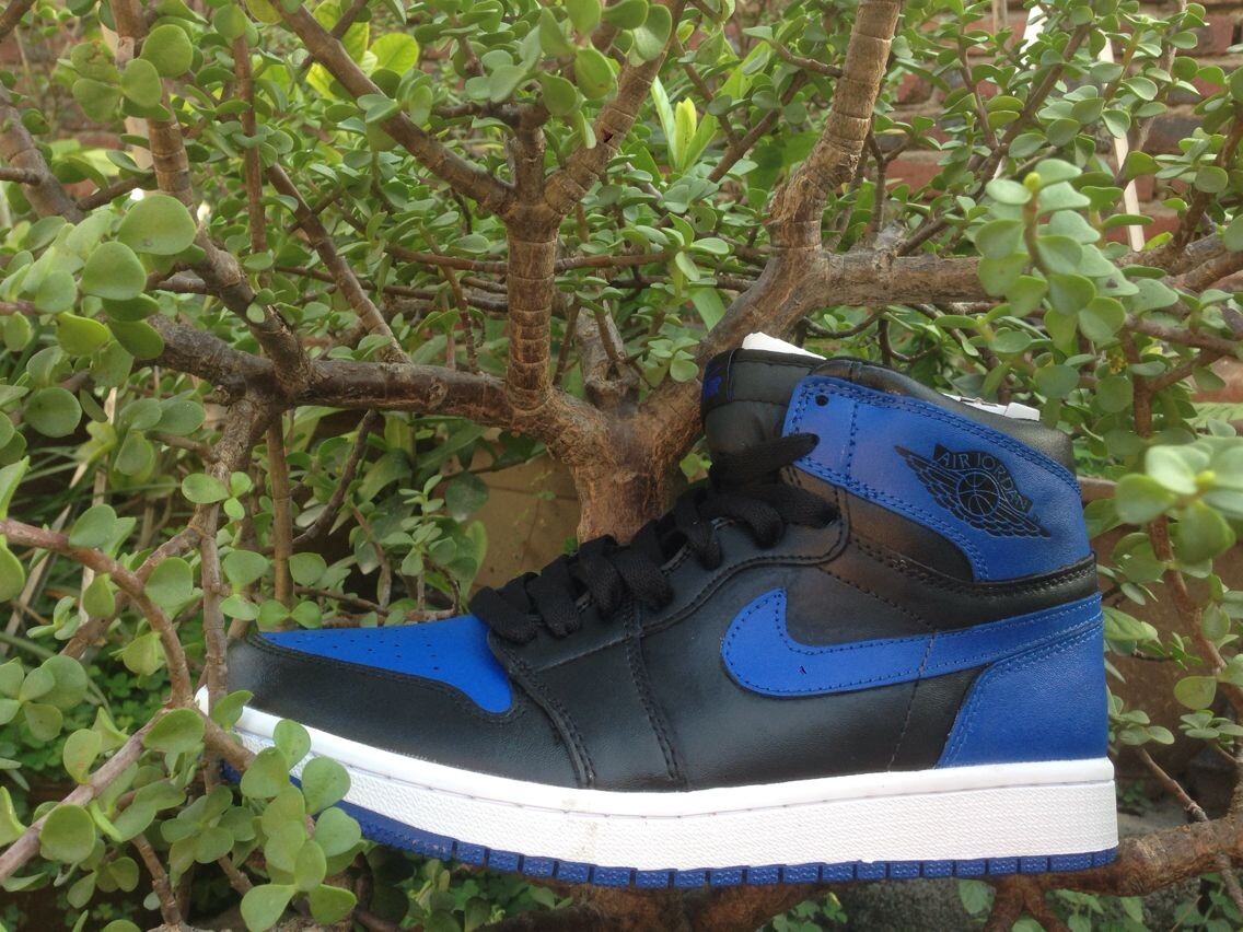 Jordan 1 High Basketball Sneakers in Blue and Black - product image from the listing.