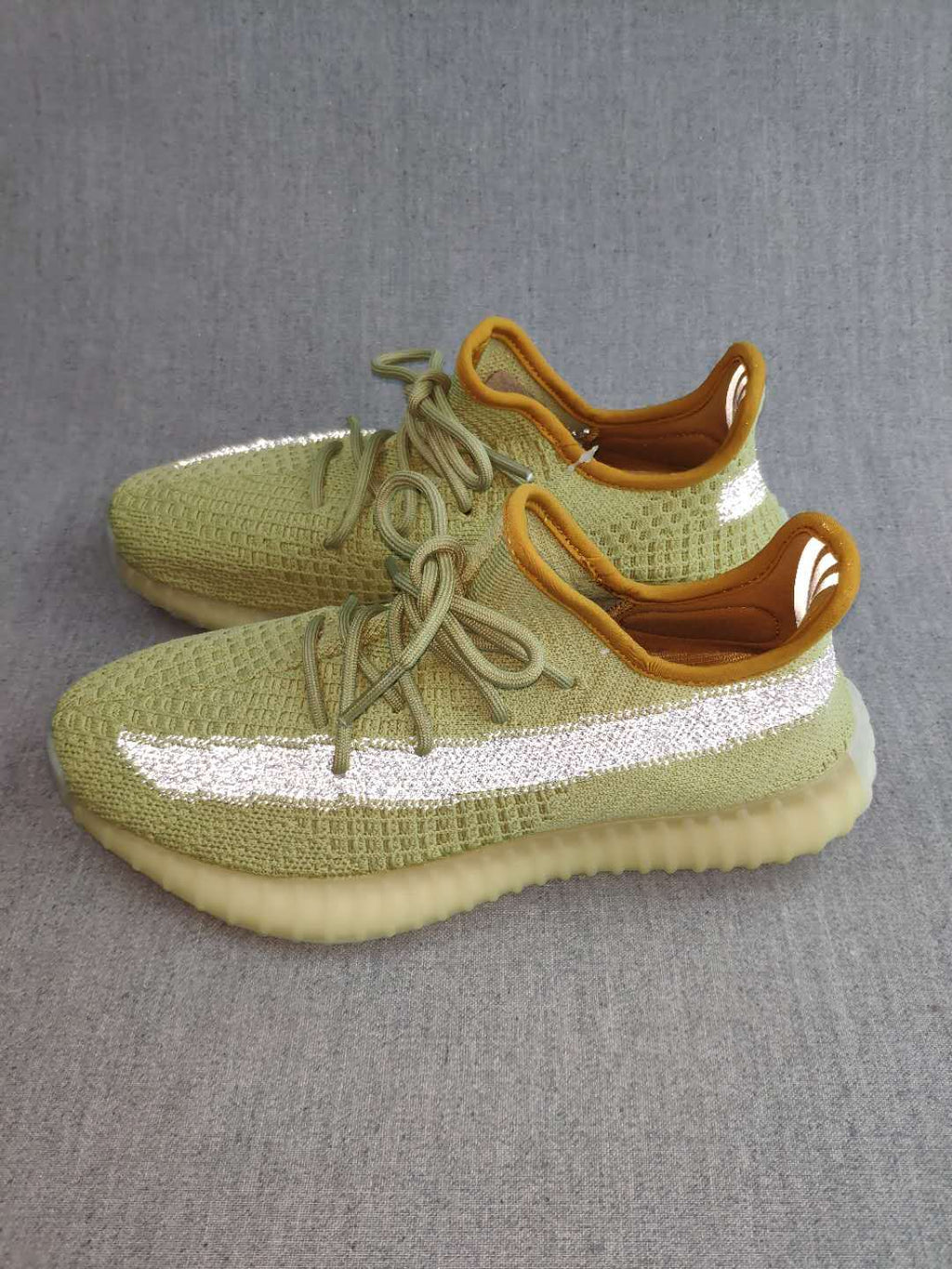 Yeezy 350 V2 Static Reflective Sneakers in Green - product image from the listing.