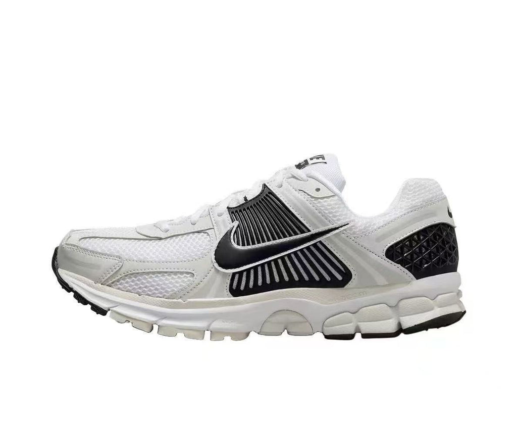 Nike Zoom Vomero 5 Sneakers in White and Black - product image from the listing.