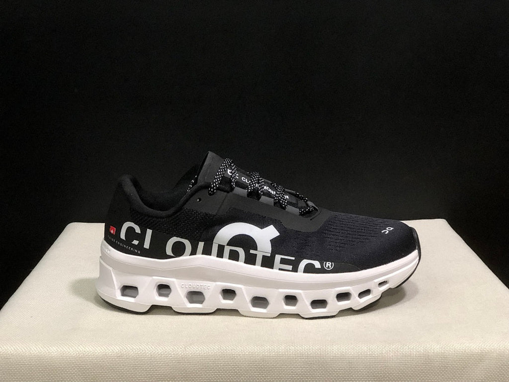 On Cloudmonster Running Sneakers in Black and White - product image from the listing.