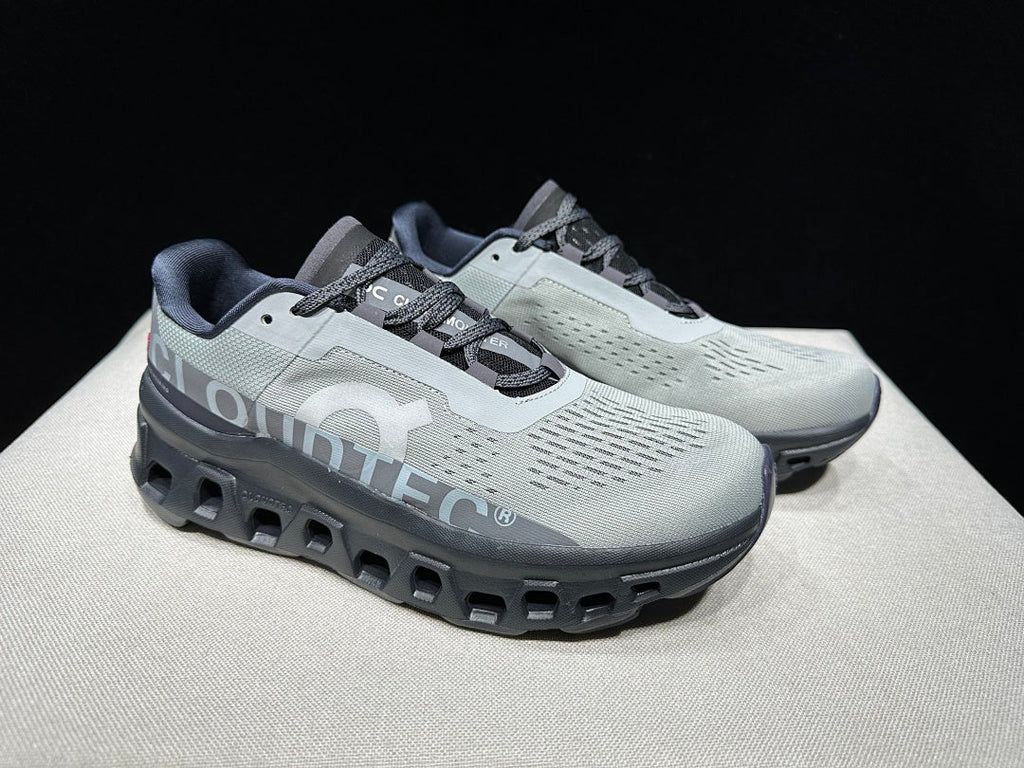 On Cloudmonster Shoes for Running in Eclipse and Magnet - product image from the listing.
