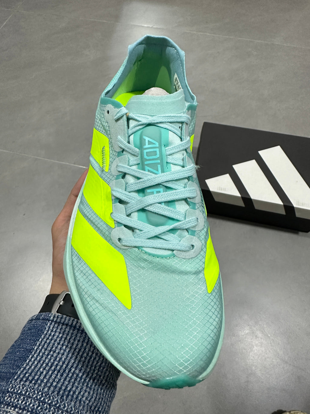 Nike Lightstrike Pro Running Shoes, in Mint Green and Volt - product image from the listing.