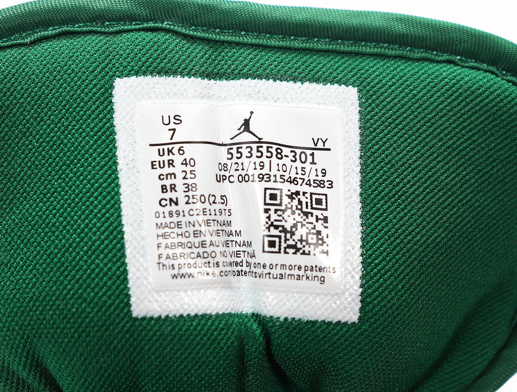 Jordan 1 Low Sneakers in White and Green 553558-301 - product image from the listing.