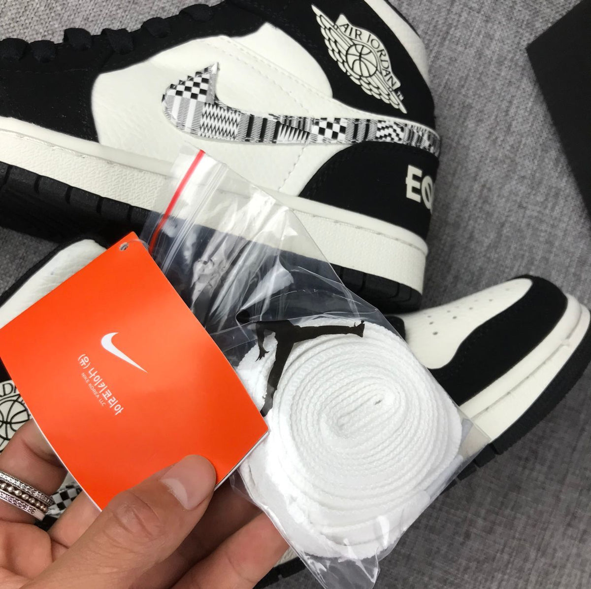 Black History Month Sneakers - Air Jordan 1 Mid 852542-010 - product image from the listing.