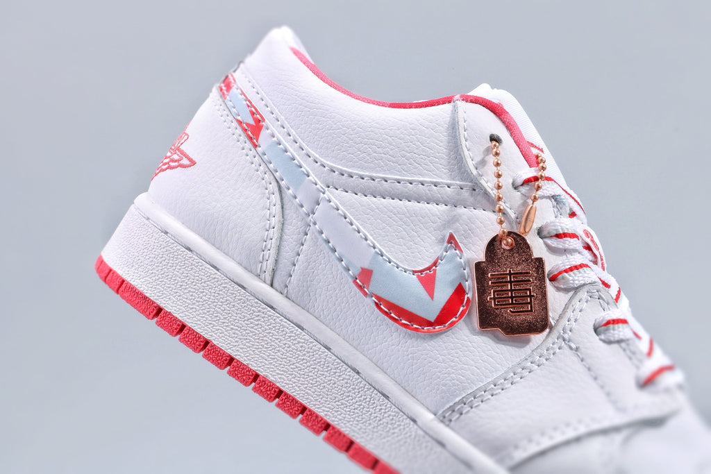 Women's Nike Air Jordan 1 Low White and Pink Sneakers - product image from the listing.
