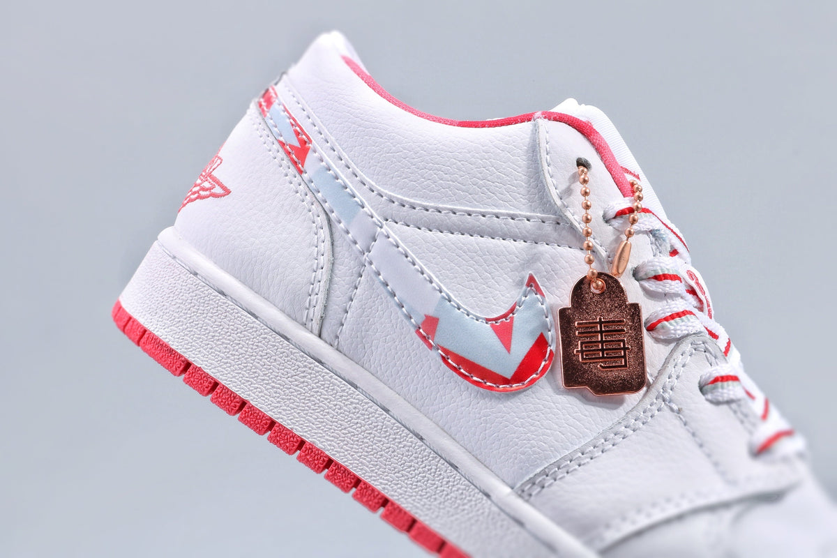 Women's Nike Air Jordan 1 Low White and Pink Sneakers - product image from the listing.