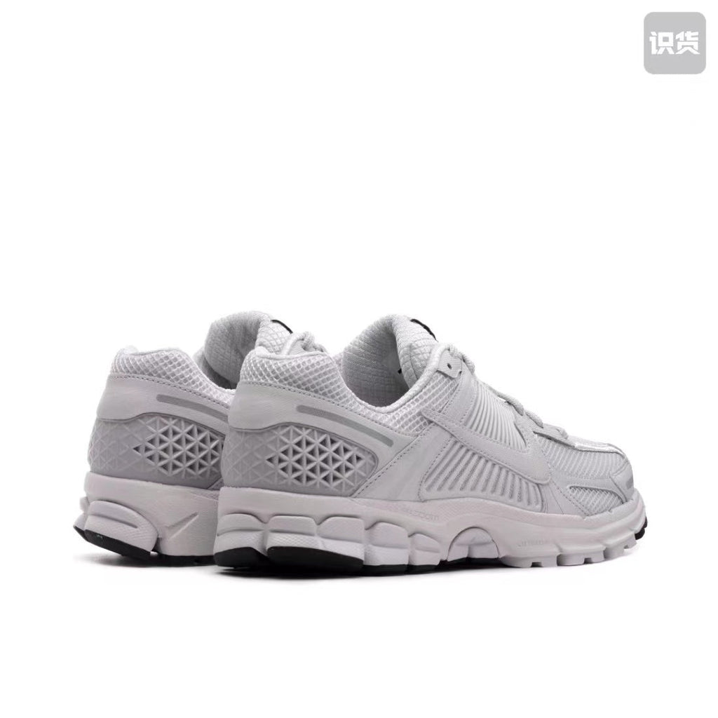 Nike Zoom Vomero 5 Sneakers in Grey and White - product image from the listing.