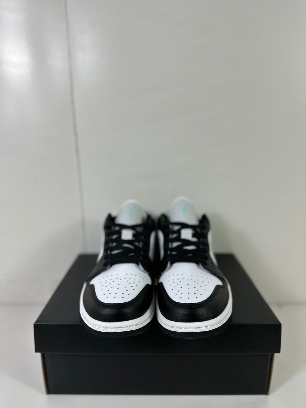 Air Jordan 1 Low White Green Black Sneakers 553558-131 - product image from the listing.