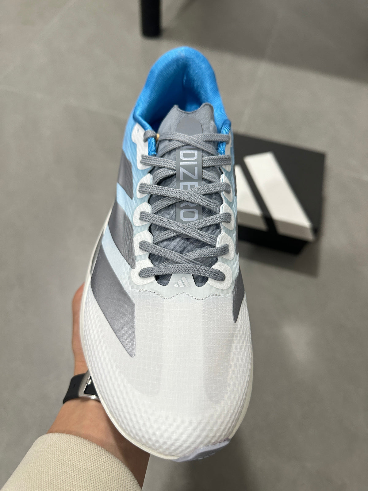 adidas Adizero EVO SL Running Shoes in White Blue JR2027 - product image from the listing.
