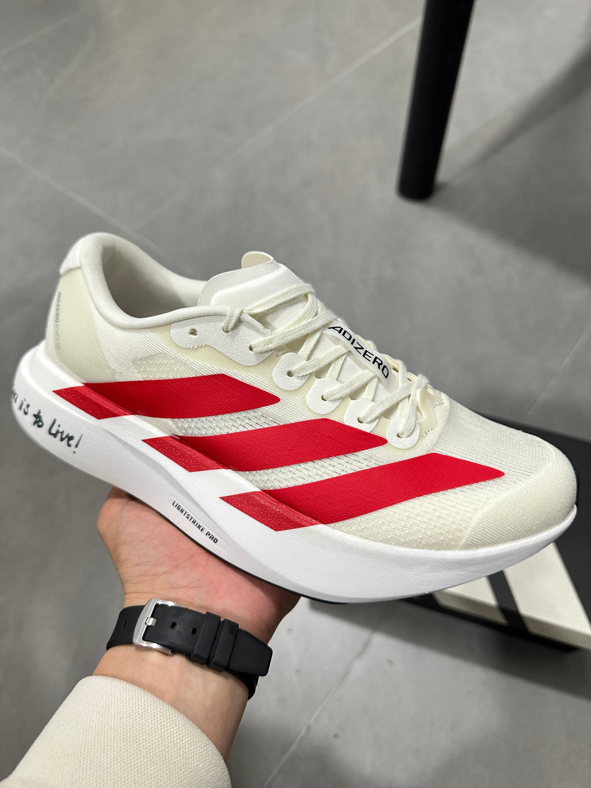 adidas Adizero Lightstrike Pro Running Shoes in White Red - product image from the listing.