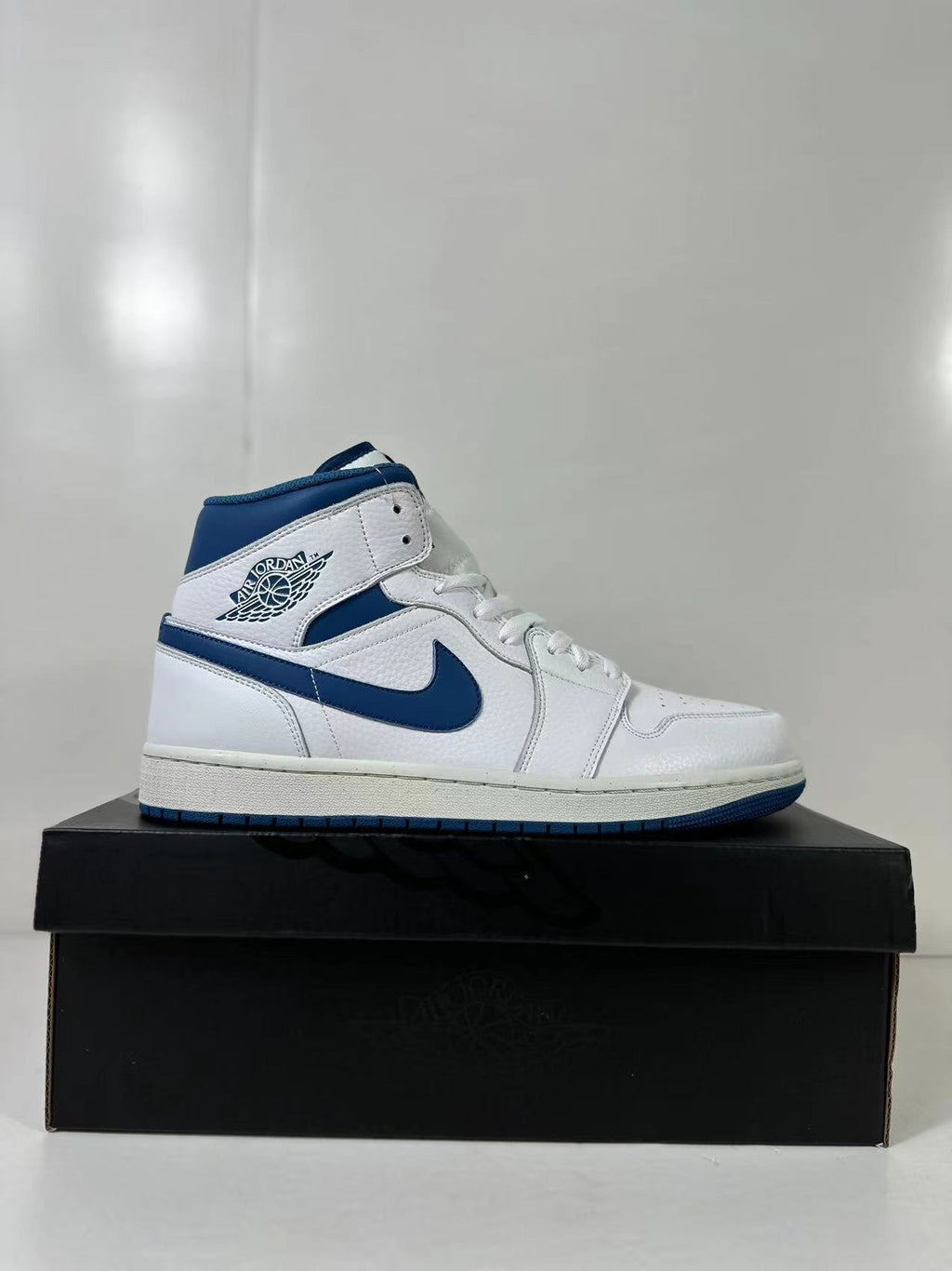 Air Jordan 1 Mid White Blue FN5215-141 Sneakers - product image from the listing.