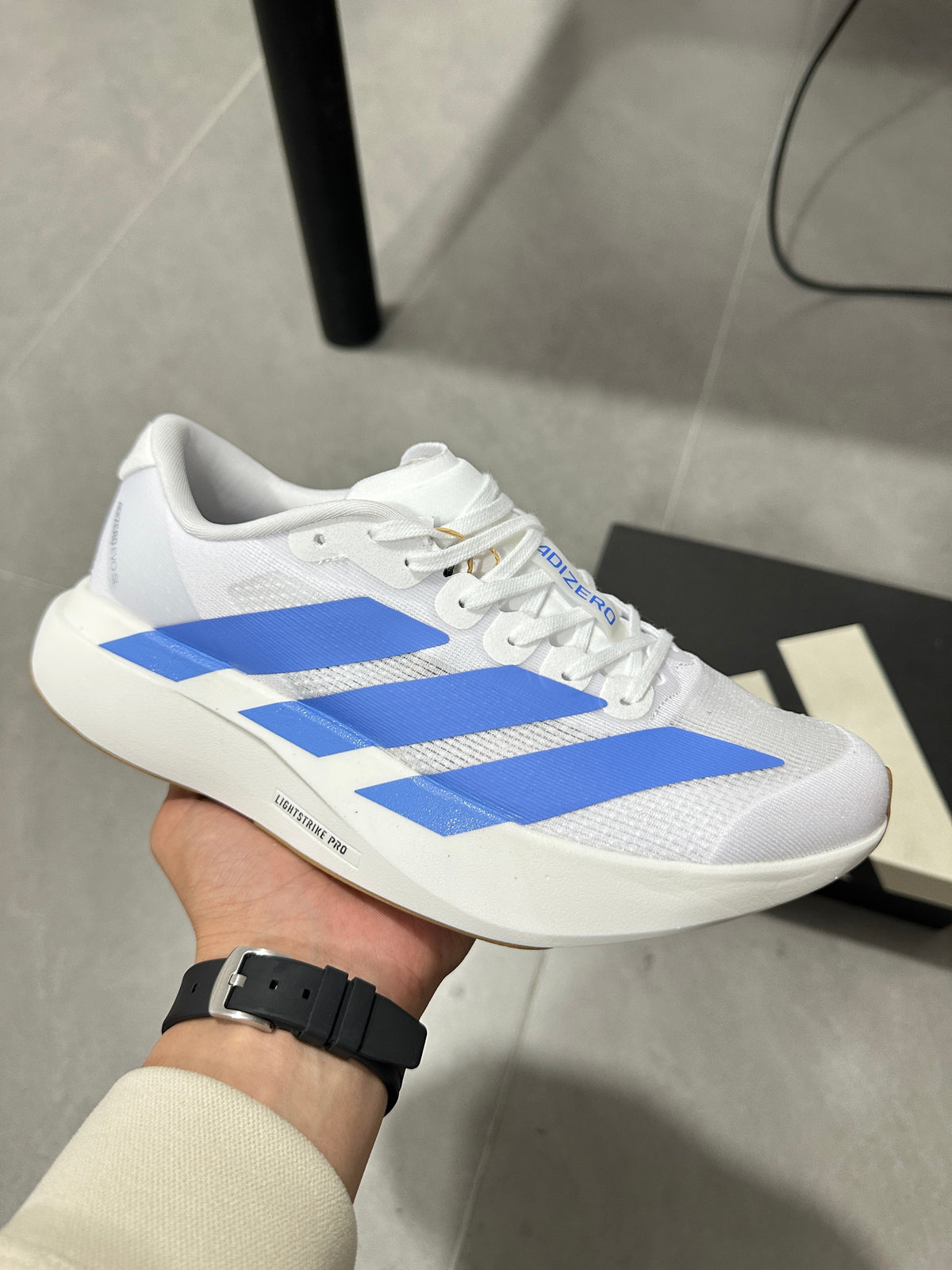 Adidas Lightstrike Pro Running Shoes in White Blue JS4454 - product image from the listing.