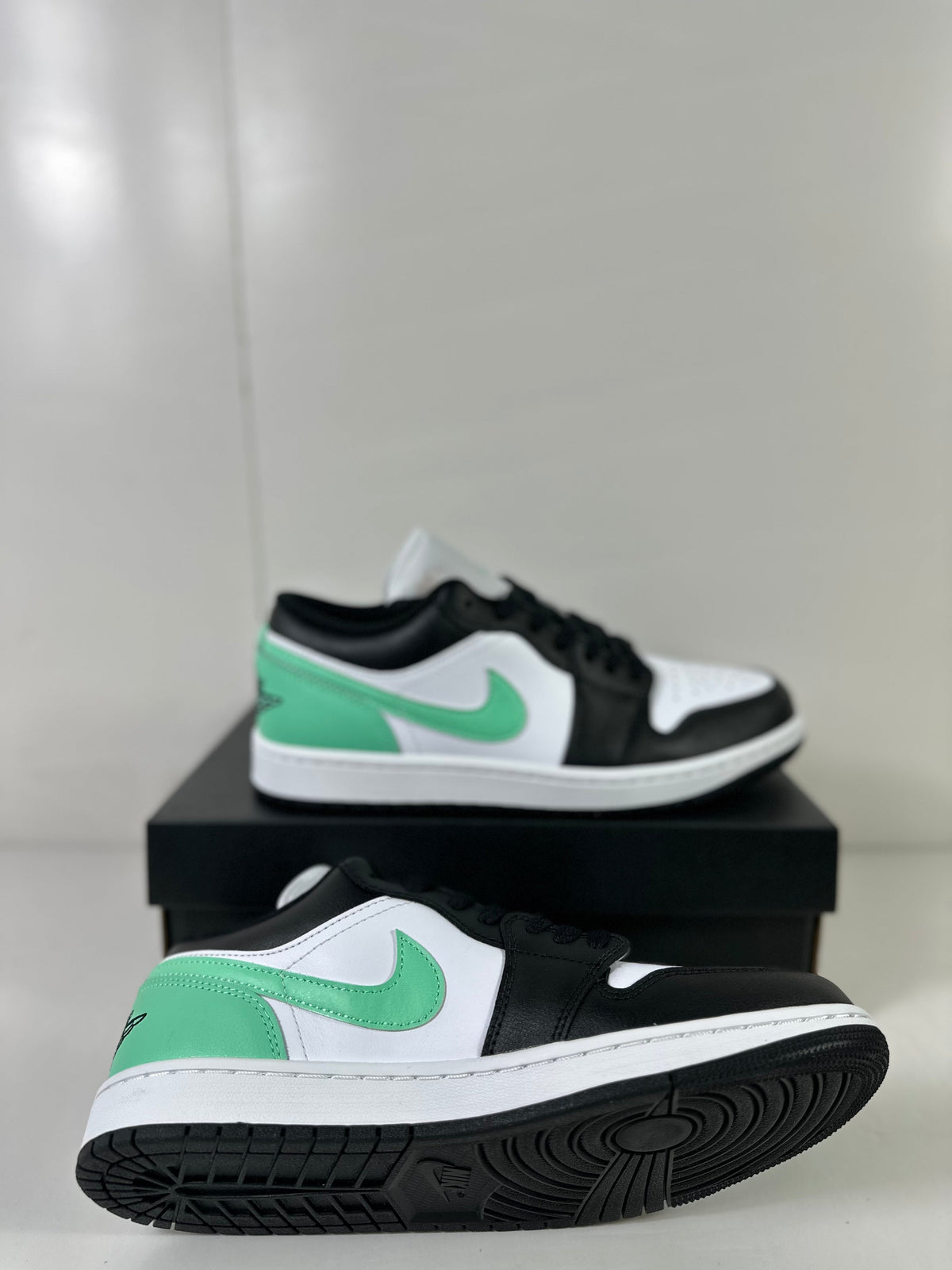 Air Jordan 1 Low White Green Black Sneakers 553558-131 - product image from the listing.