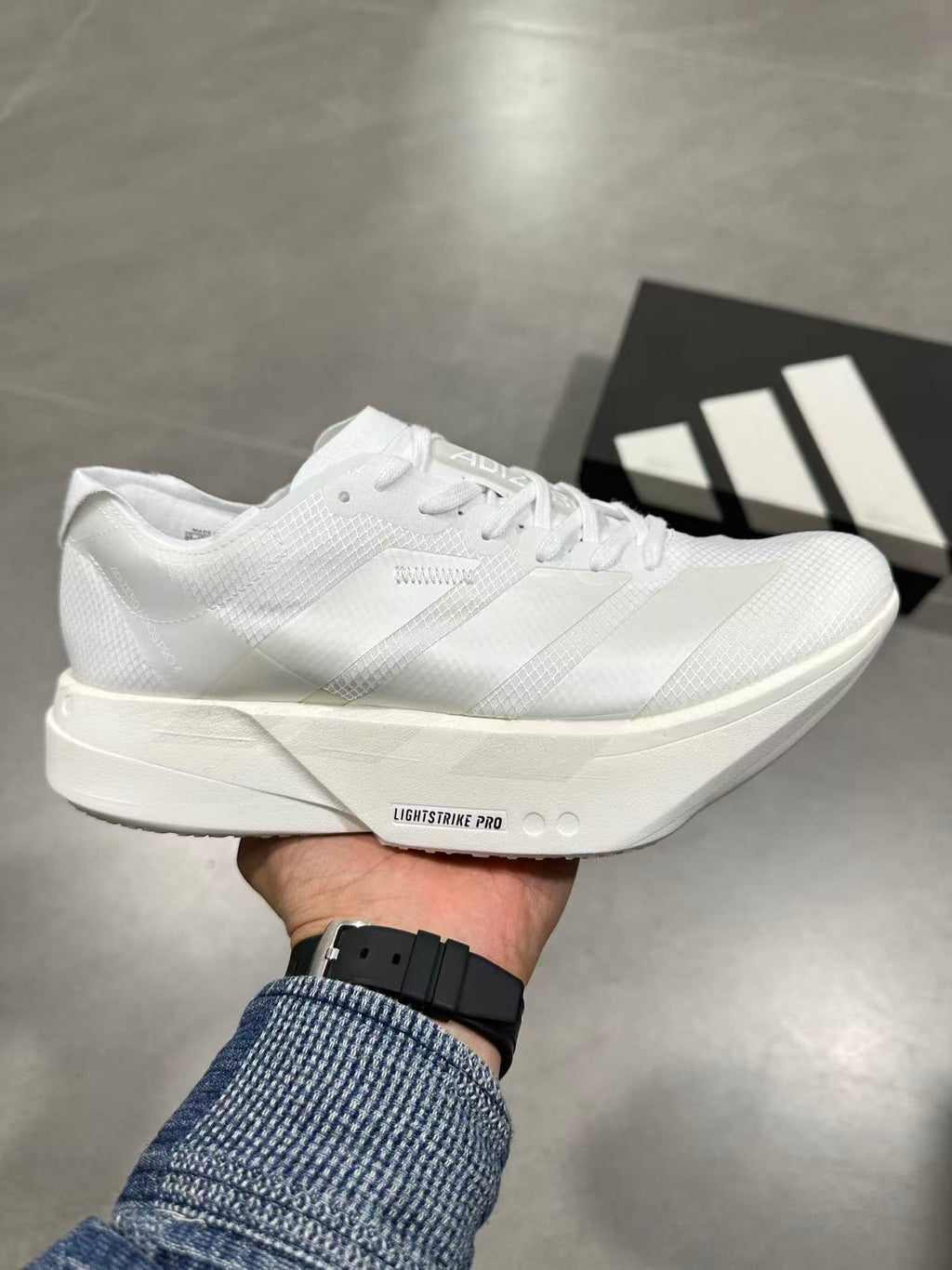 Adidas Adizero Lightstrike Pro Running Shoes in White JR6355 - product image from the listing.