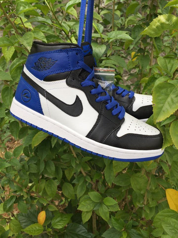 Jordan 1 High Sneakers in Black, in White and Royal Blue - product image from the listing.