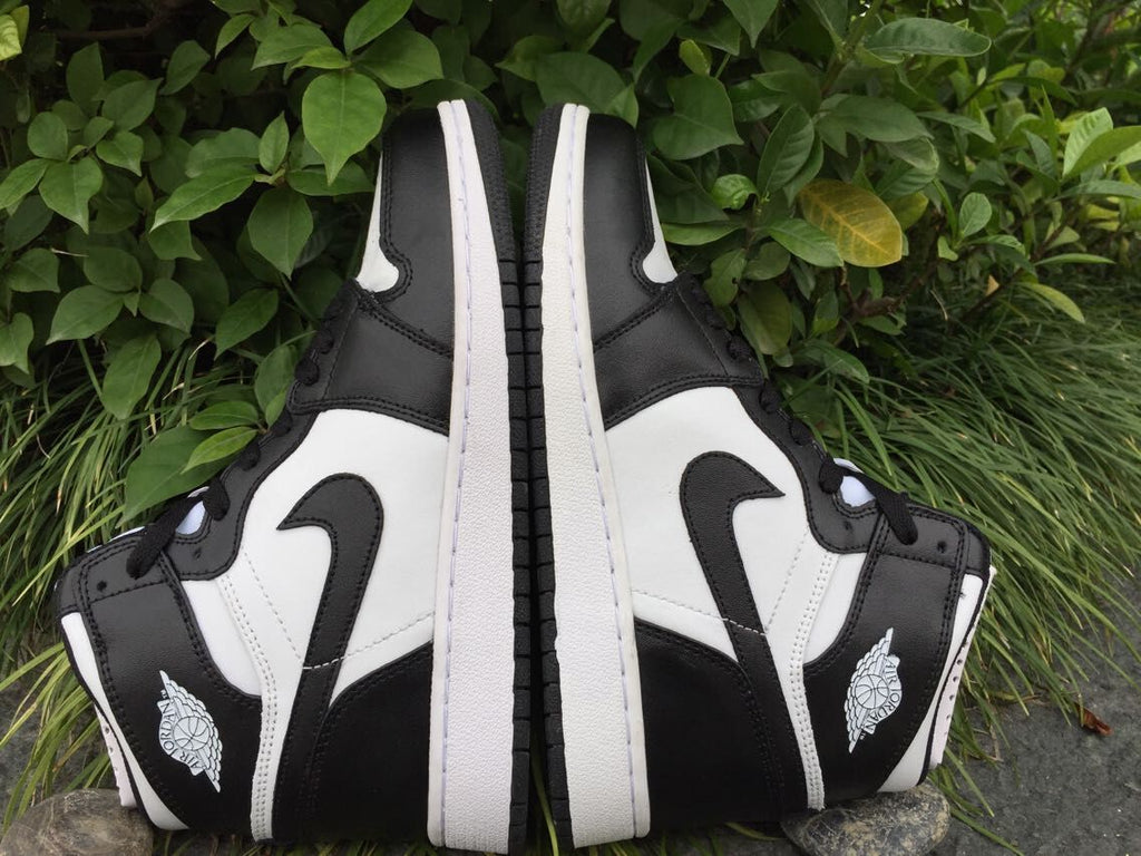 Women's Jordan 1 High Black and White Sneakers - product image from the listing.