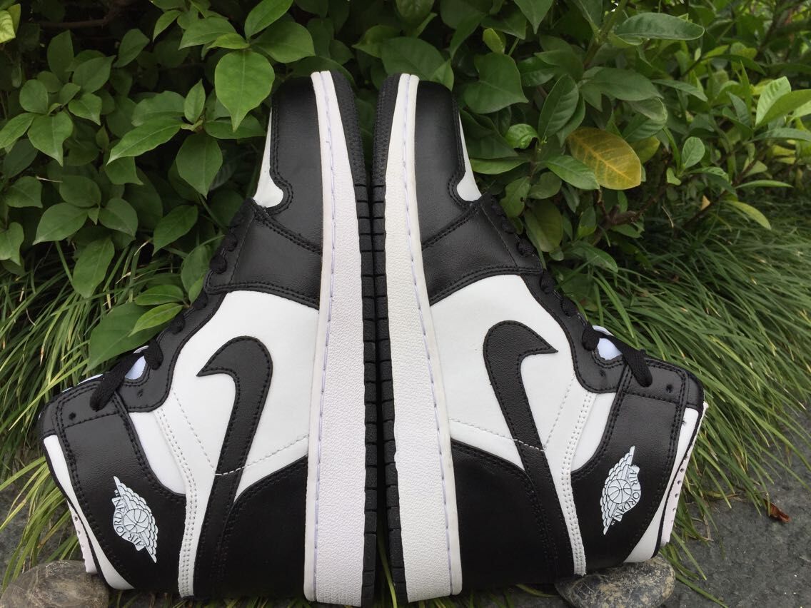 Women's Jordan 1 High Black and White Sneakers - product image from the listing.