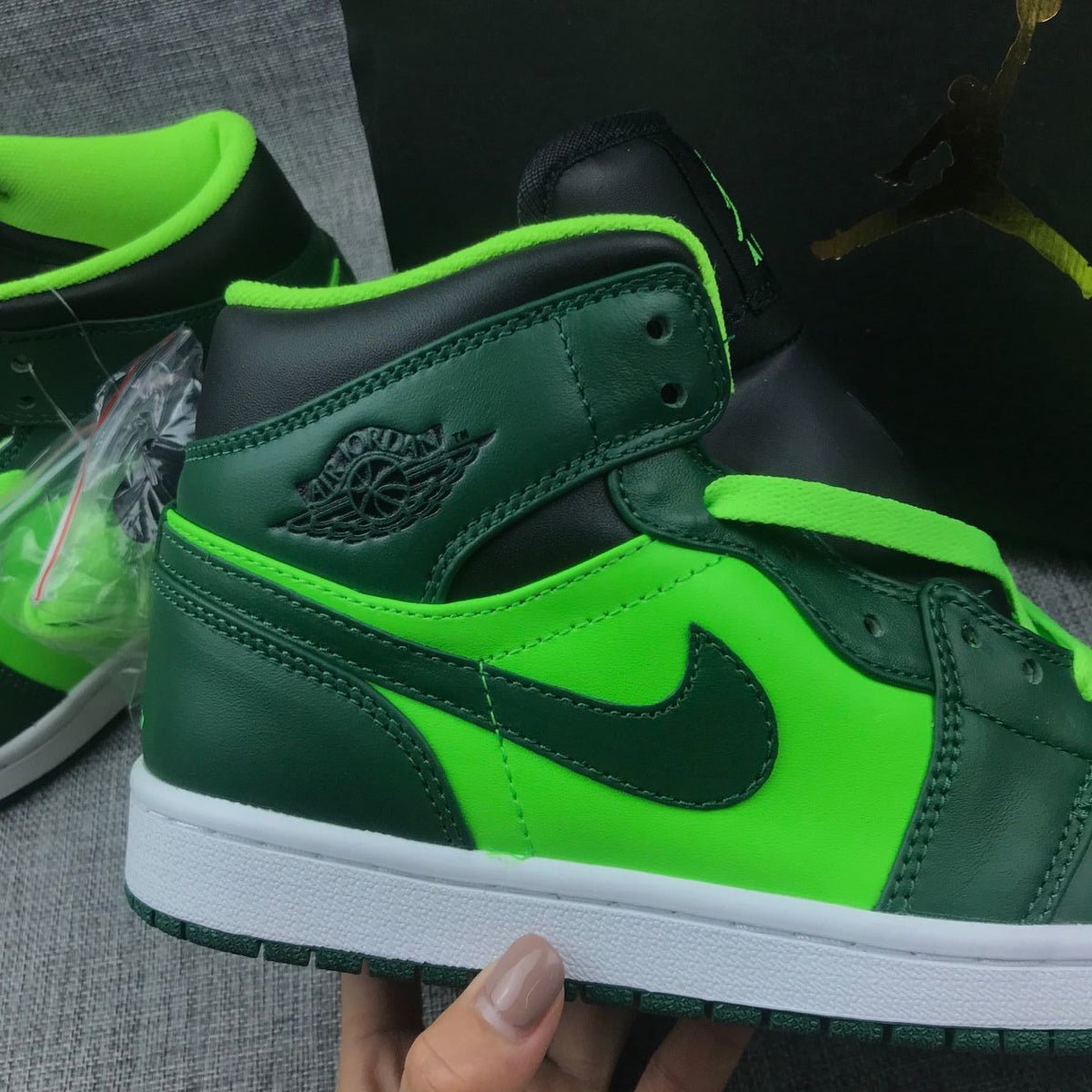Air Jordan 1 Mid Fluorescent Sneakers in Green 554724-330 - product image from the listing.