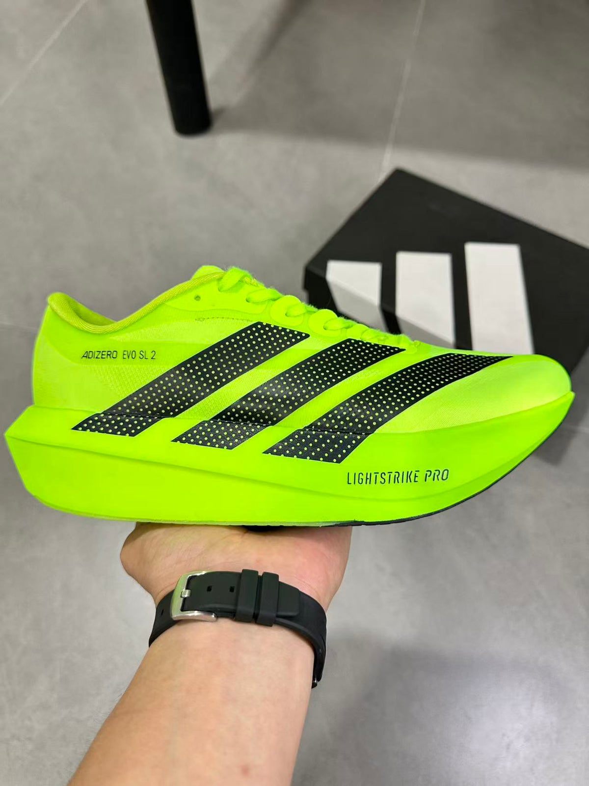 adidas Adizero Evo SL 2 Neon Running Shoes in Yellow - product image from the listing.