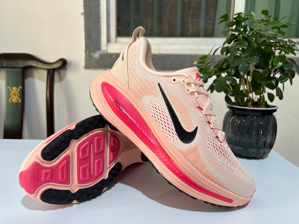 Nike Vomero 18 Running Shoes in Cream Pink - product image from the listing.