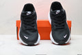 Nike Revolution 8 Running Shoes in Black and Pink - product image from the listing.