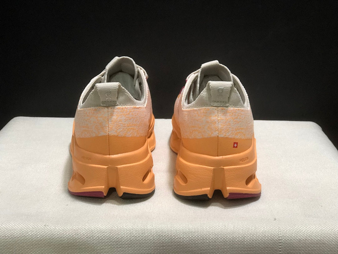 On Cloudsurfer Max Shoes for Running in Pearl and Tangerine - product image from the listing.