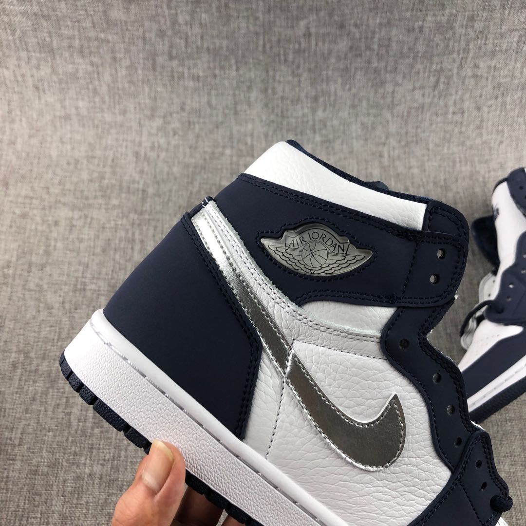 Air Jordan 1 Co.JP High Sneakers White Navy Silver DC1788-100 - product image from the listing.