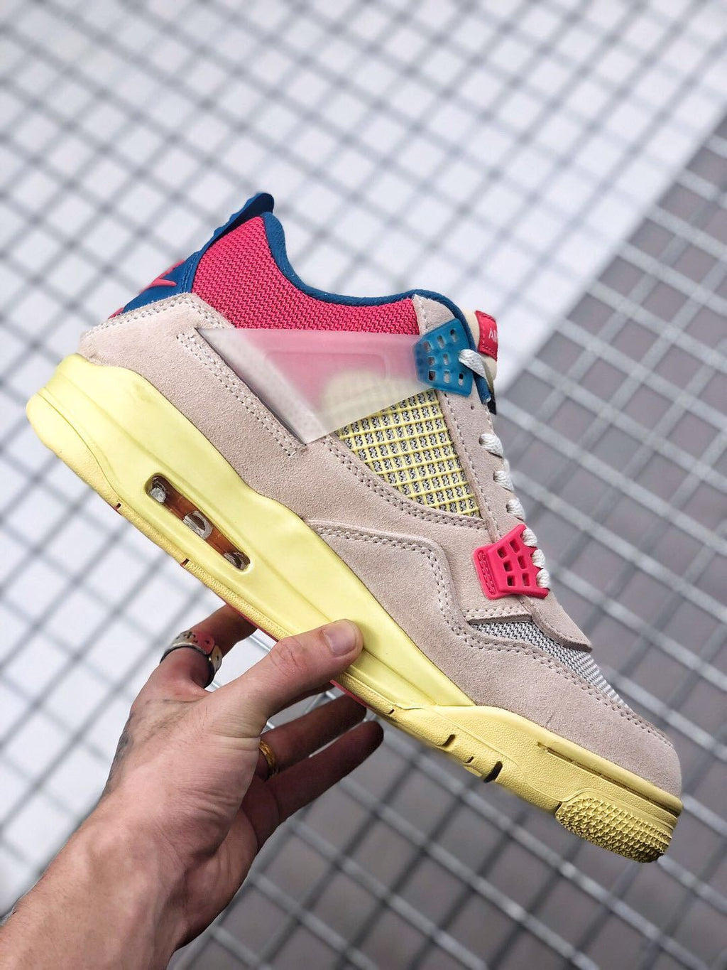 Union x Air Jordan 4 Sneakers in Pink Beige Navy Yellow - product image from the listing.