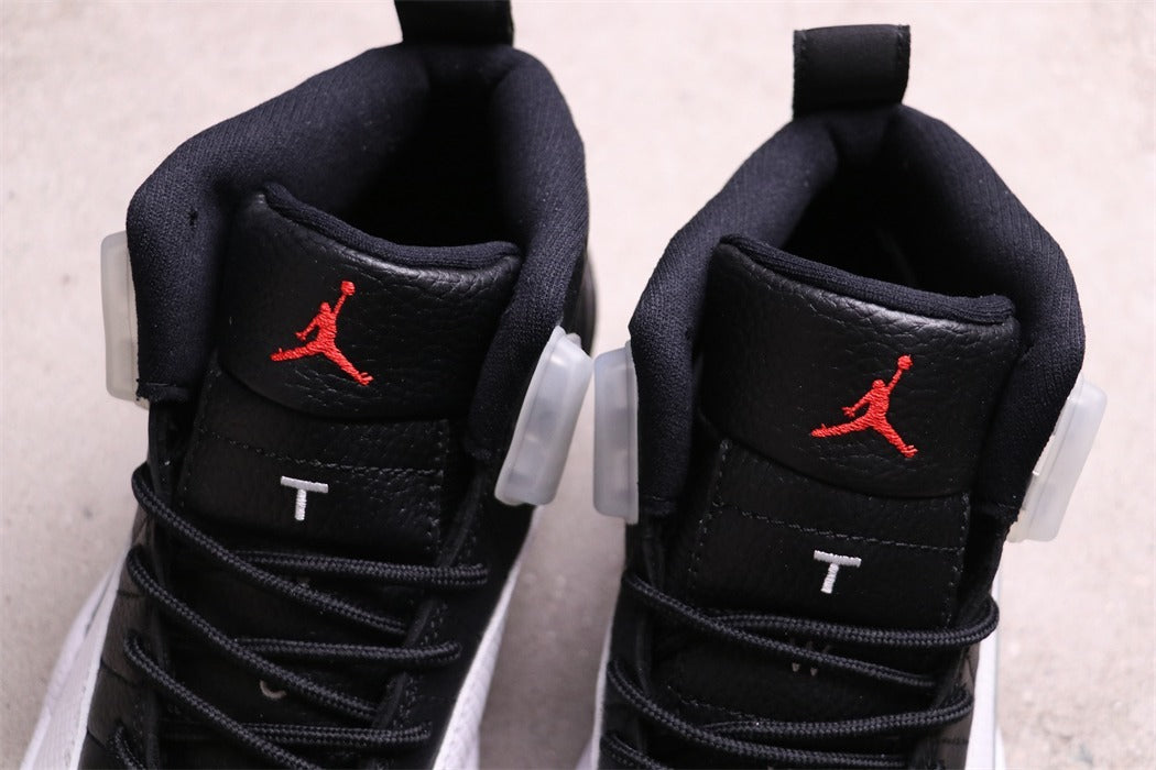 Air Jordan 12 Reverse Taxi Black White 130690-001 - product image from the listing.