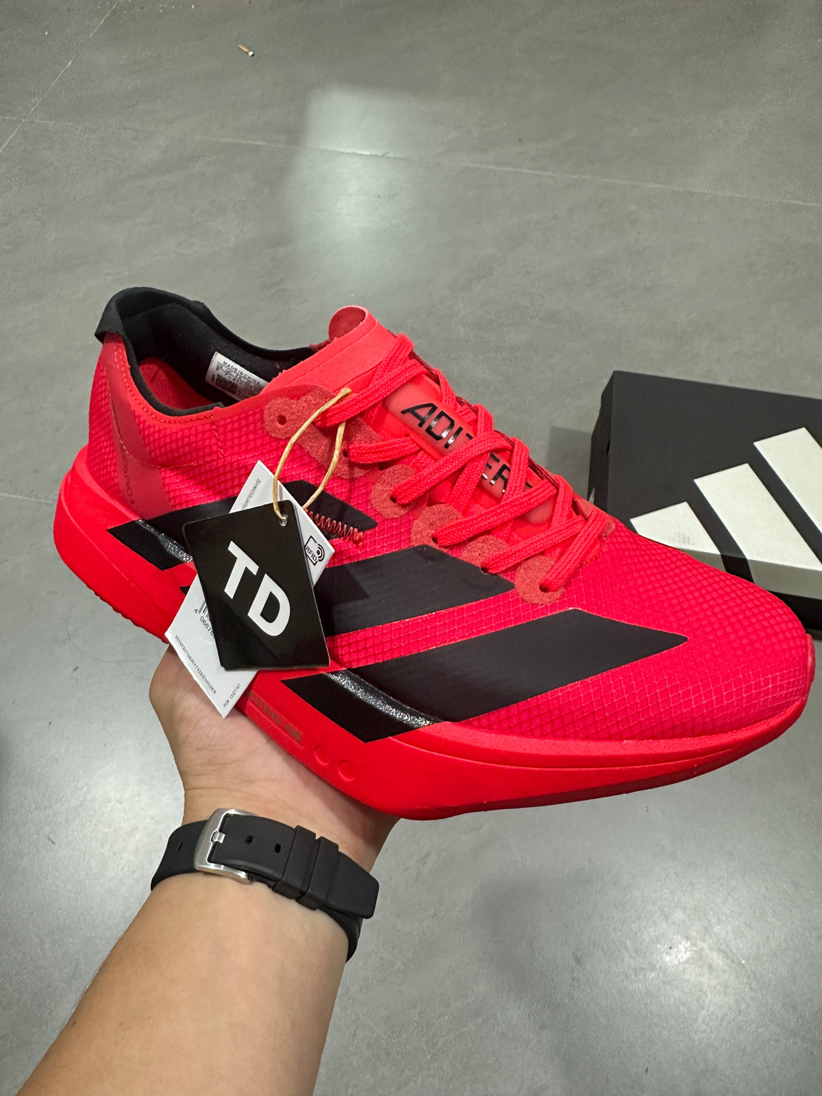 Nike Adizero Evo SL Running Shoes in Red Black JR6356 - product image from the listing.