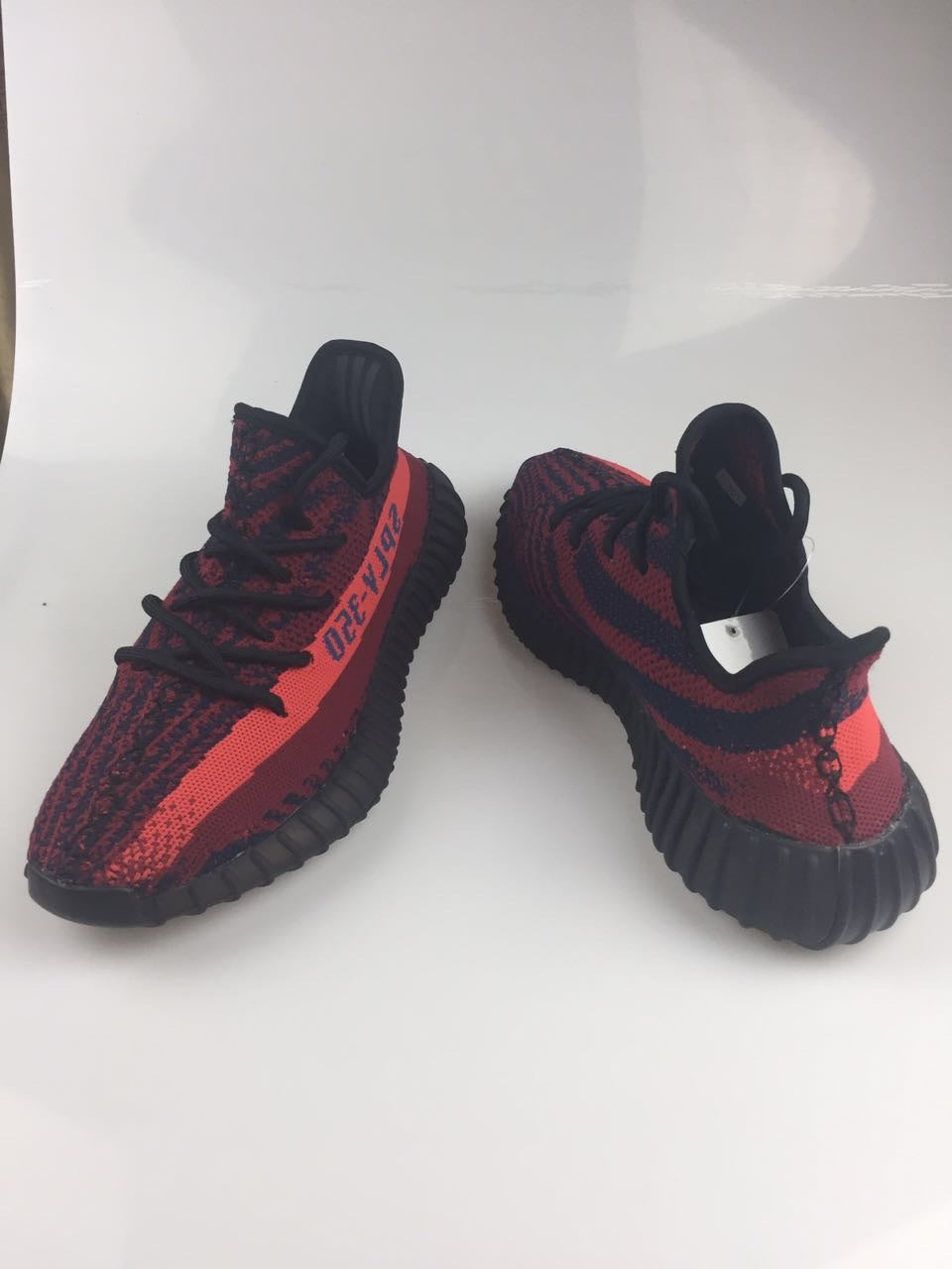 Adidas Yeezy Boost 350 V2 Sneakers in Black and Burgundy - product image from the listing.