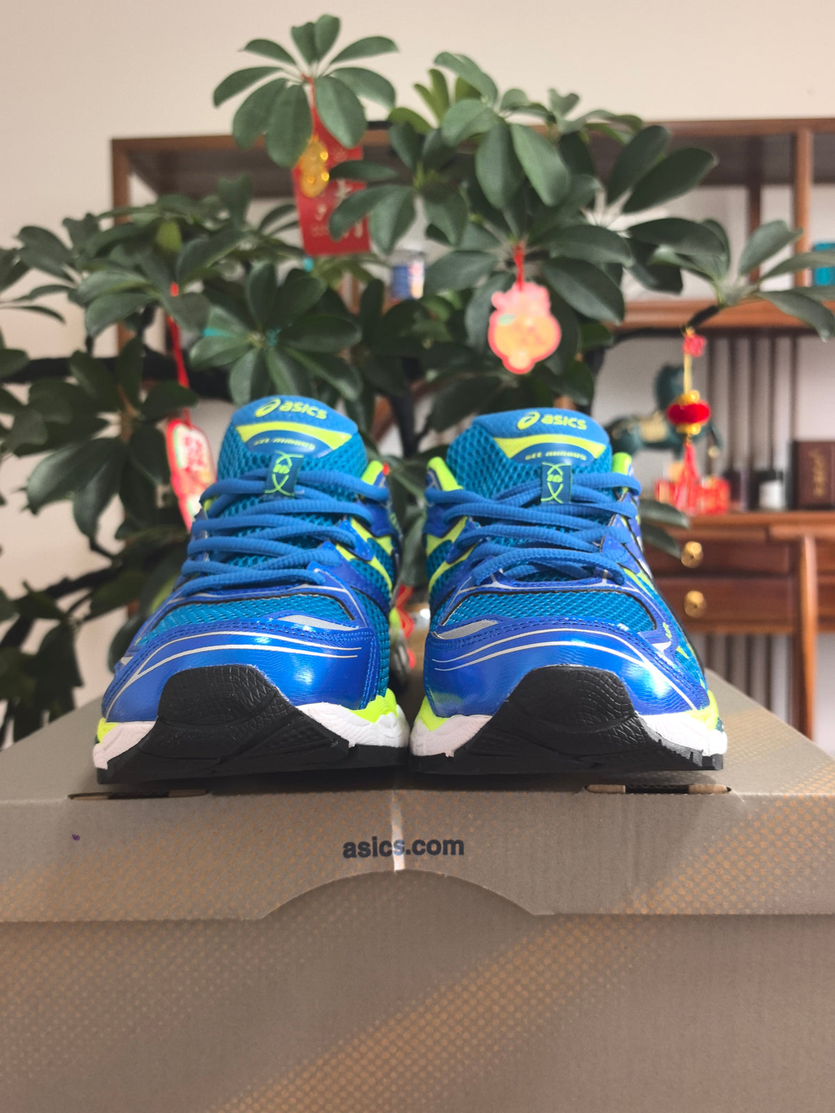 ASICS GEL-NIMBUS 16 Sneakers, Blue and Neon in Yellow - product image from the listing.