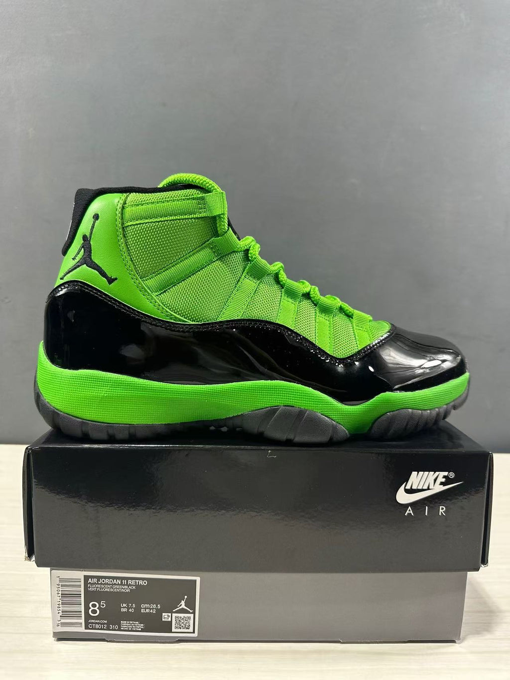 Air Jordan 11 Retro Sneakers in Black Green CT8012-310 - product image from the listing.