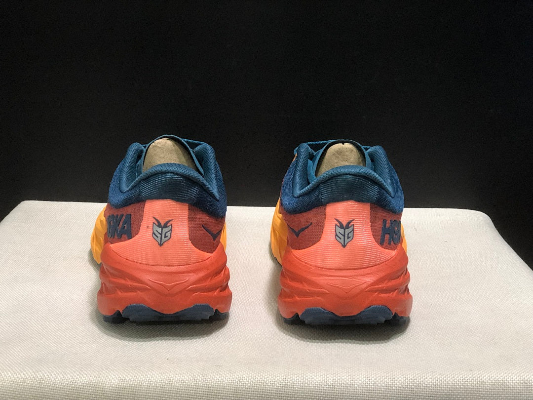 HOKA Speedgoat 5 Trail Running Shoes, in Blue and Orange - product image from the listing.