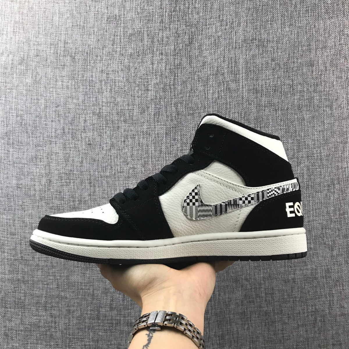 Black History Month Sneakers - Air Jordan 1 Mid 852542-010 - product image from the listing.