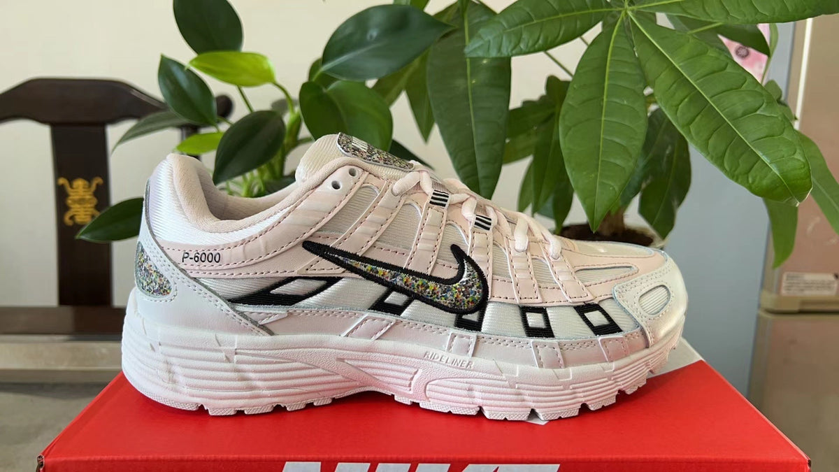 Nike P-6000 Sneakers in White and Pink CJ9585-600 - product image from the listing.