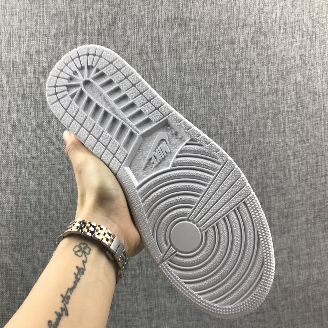 Air Jordan 1 Mid Sneakers in White Silver 554724-105 - product image from the listing.