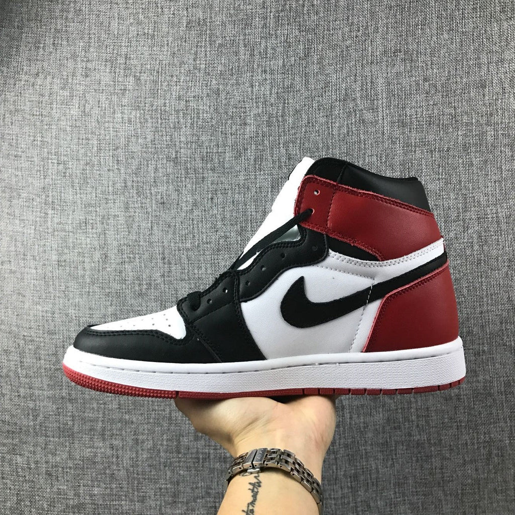 Black Toe Sneakers - Air Jordan 1 High 555088-184 - product image from the listing.